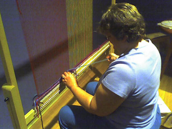 Margie weaving at the Museum of International Folk Art